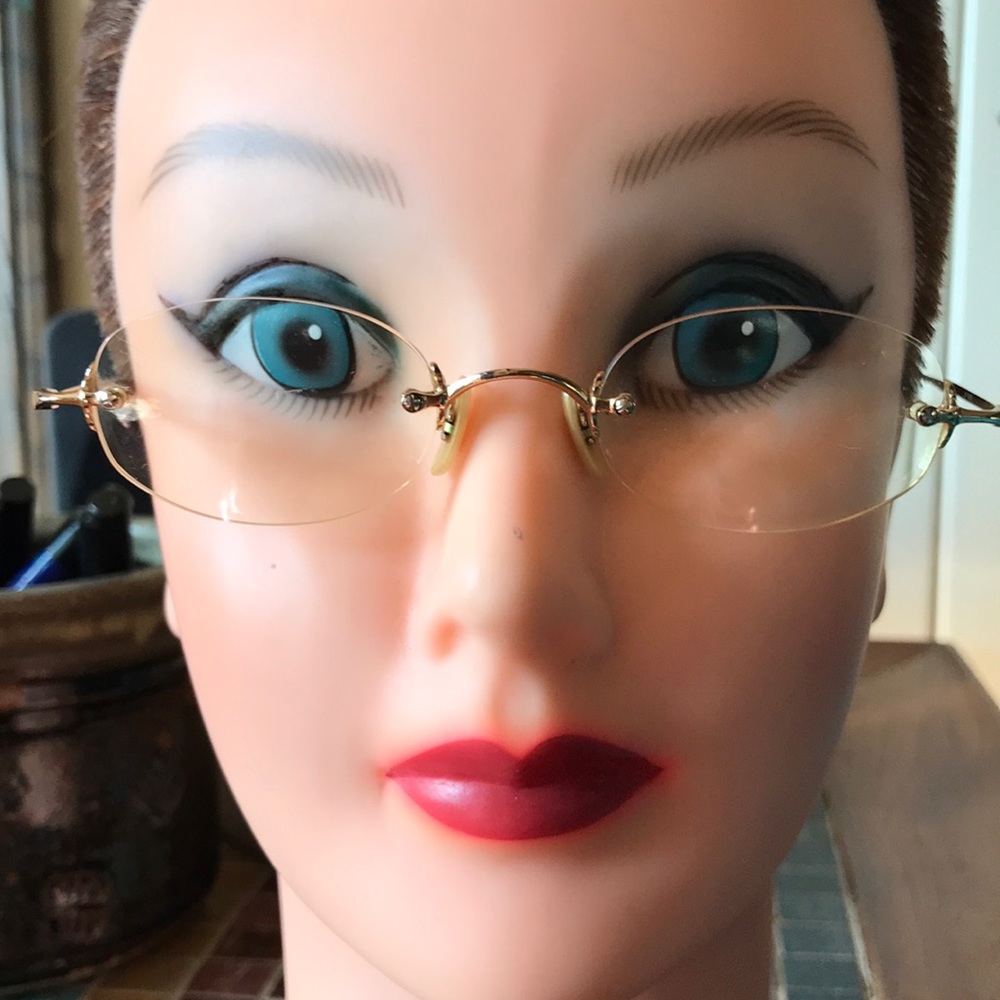 Petite gold Oliver Peoples eyeglass frames in excellent condition.